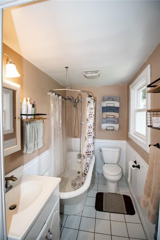 901 Alexander St, Shaler, PA 15116 - full bathroom featuring a wainscoted wall, vanity, tile patterned floors, and a decorative wall