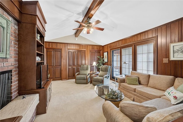 566 Ridgeview Rd, East Huntingdon, PA 15666 - carpeted living area featuring wood walls, a ceiling fan, and a fireplace