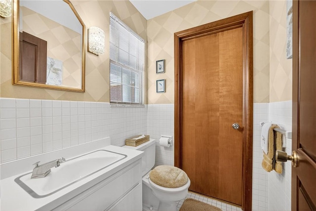 566 Ridgeview Rd, East Huntingdon, PA 15666 - bathroom featuring tile walls, a wainscoted wall, vanity, and tile patterned flooring