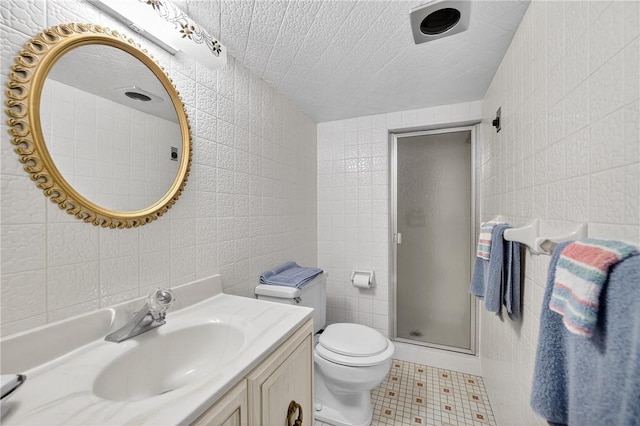 566 Ridgeview Rd, East Huntingdon, PA 15666 - bathroom with tile walls, vanity, a stall shower, and tile patterned floors