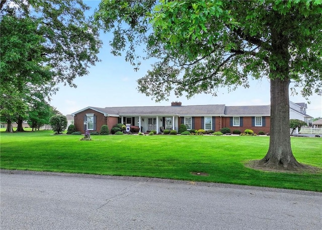566 Ridgeview Rd, East Huntingdon, PA 15666 - ranch-style house featuring a front yard and a chimney
