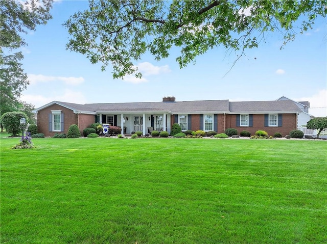 566 Ridgeview Rd, East Huntingdon, PA 15666 - single story home with a front yard, a chimney, and brick siding