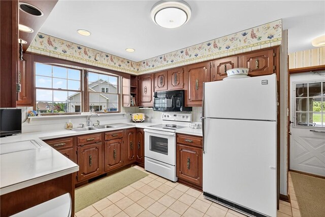 566 Ridgeview Rd, East Huntingdon, PA 15666 - kitchen with white appliances, light countertops, and light tile patterned flooring