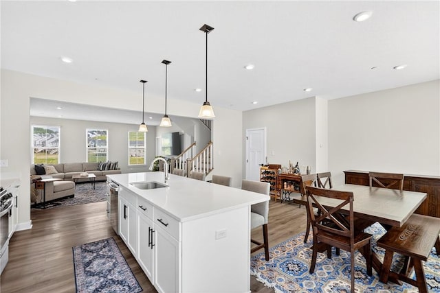 124 Rivulet Pl, Jackson Twp, PA 16063 - kitchen with dark wood-style floors, recessed lighting, a center island with sink, light countertops, and white cabinets