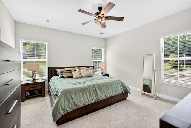 124 Rivulet Pl, Jackson Twp, PA 16063 - bedroom with light carpet, multiple windows, and a ceiling fan