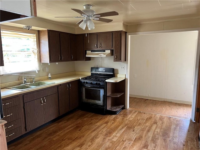 212 Shaffer Ave, Elizabeth Twp/Boro, PA 15037 - kitchen featuring black gas range, under cabinet range hood, wood finished floors, light countertops, and ceiling fan