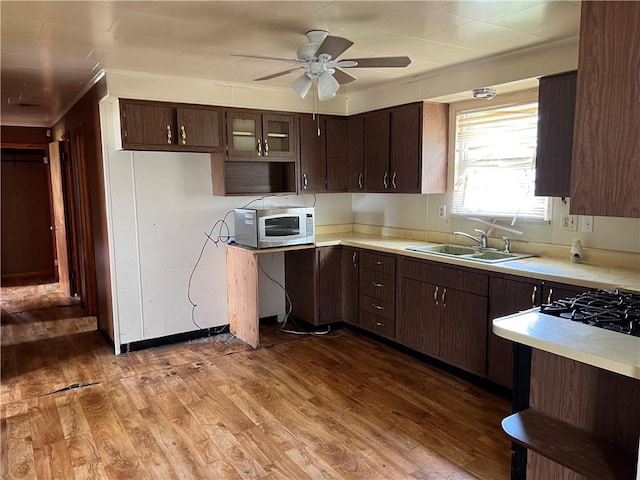 212 Shaffer Ave, Elizabeth Twp/Boro, PA 15037 - kitchen featuring stainless steel microwave, light countertops, wood finished floors, a ceiling fan, and dark brown cabinets