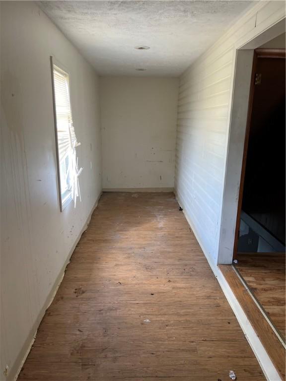 212 Shaffer Ave, Elizabeth Twp/Boro, PA 15037 - unfurnished room with wood finished floors and a textured ceiling