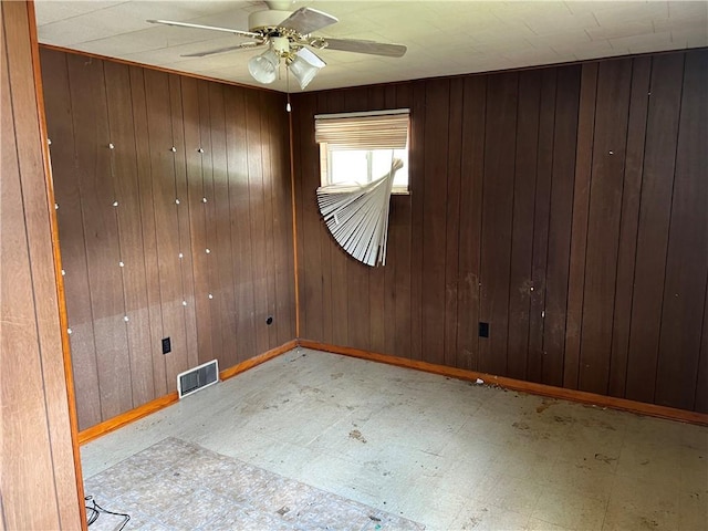 212 Shaffer Ave, Elizabeth Twp/Boro, PA 15037 - unfurnished room featuring tile patterned floors, ceiling fan, and wooden walls