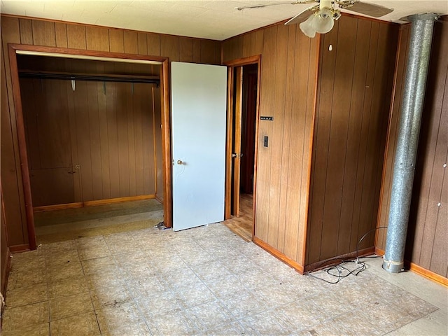 212 Shaffer Ave, Elizabeth Twp/Boro, PA 15037 - unfurnished bedroom with wooden walls, a closet, light floors, and ceiling fan