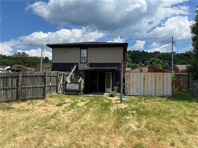 212 Shaffer Ave, Elizabeth Twp/Boro, PA 15037 - rear view of property featuring a storage unit and a fenced backyard