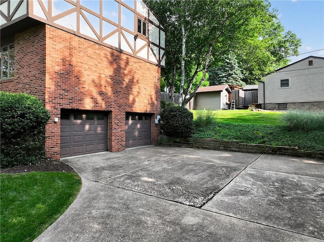 102 Barnwood Ln, Ross Twp, PA 15237 - view of home's exterior with concrete driveway, an attached garage, brick siding, and a yard