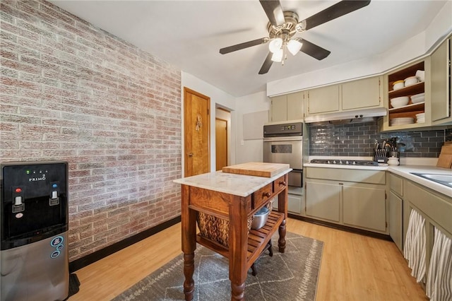 12 Lynmar Dr, Shaler, PA 15209 - kitchen featuring light wood finished floors, light countertops, brick wall, open shelves, and cooktop