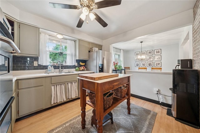 12 Lynmar Dr, Shaler, PA 15209 - kitchen featuring stainless steel refrigerator with ice dispenser, light countertops, tasteful backsplash, and gray cabinetry