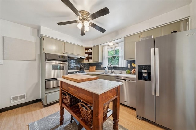 12 Lynmar Dr, Shaler, PA 15209 - kitchen with stainless steel appliances, open shelves, light countertops, a warming drawer, and decorative backsplash