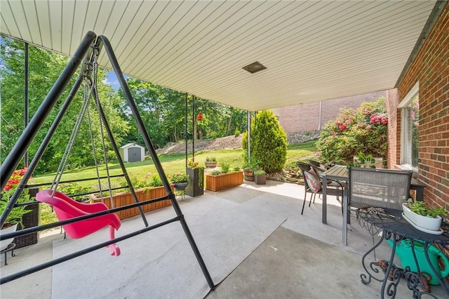 12 Lynmar Dr, Shaler, PA 15209 - view of patio / terrace with a shed and outdoor dining area
