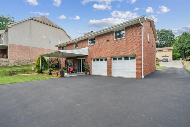 12 Lynmar Dr, Shaler, PA 15209 - view of front of property featuring asphalt driveway, brick siding, a garage, and a front lawn