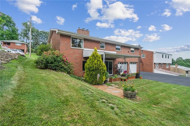 12 Lynmar Dr, Shaler, PA 15209 - view of front of house with brick siding, a chimney, driveway, and a front yard