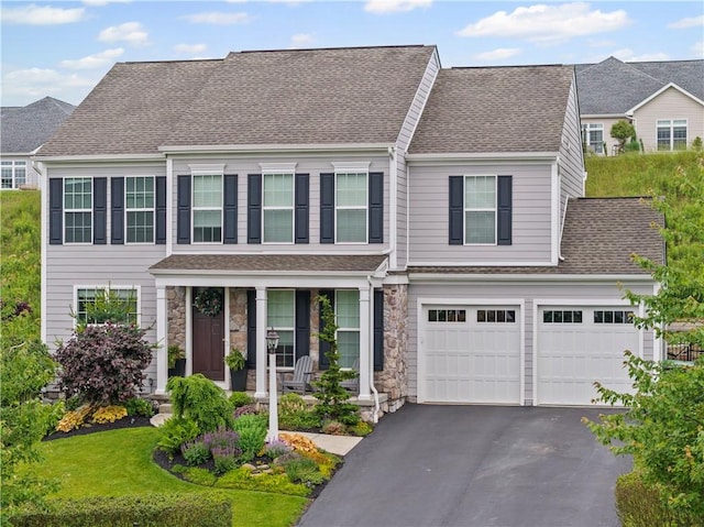 109 Overbrook Dr, Cranberry Twp, PA 16066 - view of front of house with asphalt driveway, a porch, roof with shingles, an attached garage, and stone siding