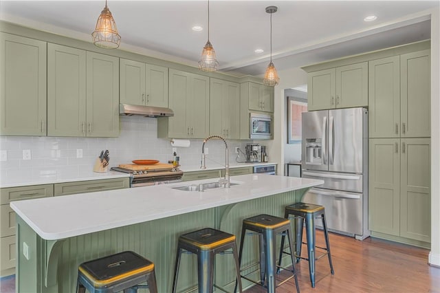 109 Overbrook Dr, Cranberry Twp, PA 16066 - kitchen with appliances with stainless steel finishes, under cabinet range hood, light countertops, backsplash, and green cabinets