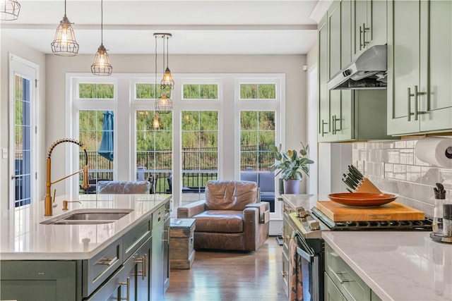 109 Overbrook Dr, Cranberry Twp, PA 16066 - kitchen featuring green cabinets, stainless steel range with electric stovetop, under cabinet range hood, tasteful backsplash, and wood finished floors