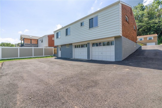 1625 Loretta Dr, Penn Hills, PA 15235 - back of property with a garage and driveway