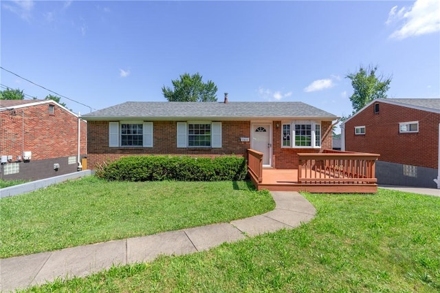 1625 Loretta Dr, Penn Hills, PA 15235 - ranch-style home with brick siding, a front yard, and a wooden deck