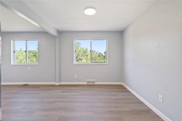 1625 Loretta Dr, Penn Hills, PA 15235 - unfurnished room featuring healthy amount of natural light and wood finished floors