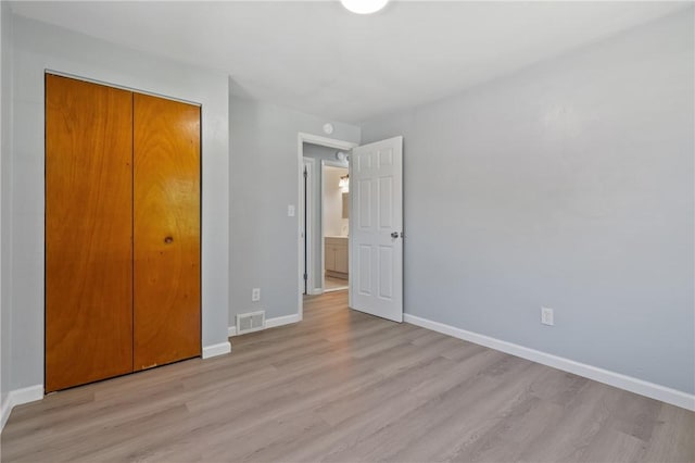 1625 Loretta Dr, Penn Hills, PA 15235 - unfurnished bedroom featuring light wood finished floors and a closet
