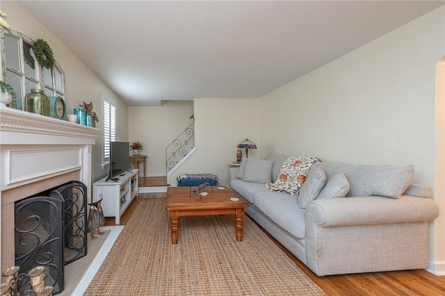 4800 W Brierly Dr, West Mifflin, PA 15122 - living room with a fireplace with flush hearth and light wood-style flooring