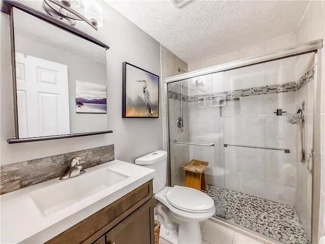 534 Hunters Path Rd, South Fayette, PA 15017 - full bathroom featuring vanity, a stall shower, a textured ceiling, and tile patterned floors