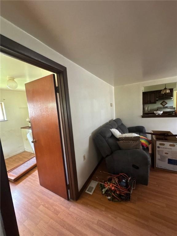 6036 Sawyer St, Lawrenceville, PA 15201 - living area with light wood-style flooring and baseboards