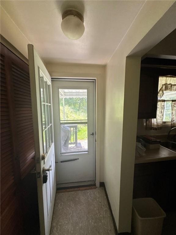 6036 Sawyer St, Lawrenceville, PA 15201 - doorway to outside featuring baseboards