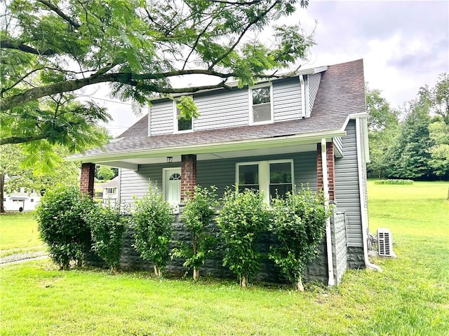 718 Breakneck Rd, Bullskin Twp, PA 15425 - view of front of property with a front lawn, covered porch, and a shingled roof