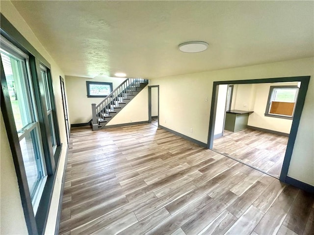 718 Breakneck Rd, Bullskin Twp, PA 15425 - empty room with wood finished floors and stairs