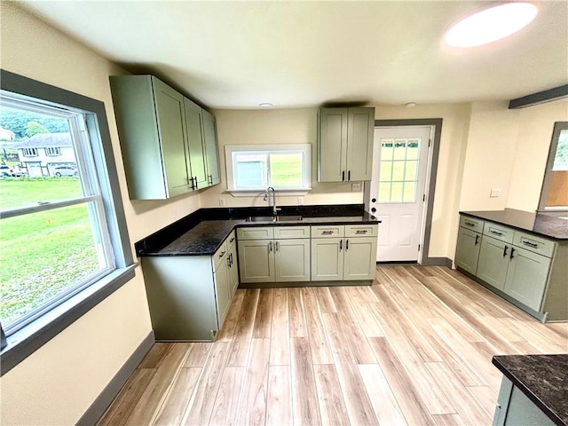 718 Breakneck Rd, Bullskin Twp, PA 15425 - kitchen with light wood finished floors and dark stone counters