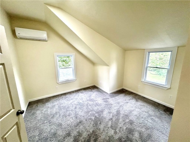 718 Breakneck Rd, Bullskin Twp, PA 15425 - additional living space featuring a wall mounted air conditioner, carpet flooring, and lofted ceiling