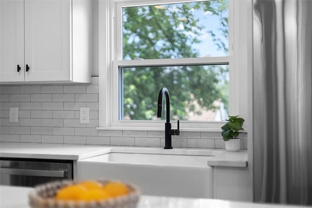 1610 Duffield St, Morningside, PA 15206 - kitchen featuring light countertops, decorative backsplash, white cabinets, and dishwasher