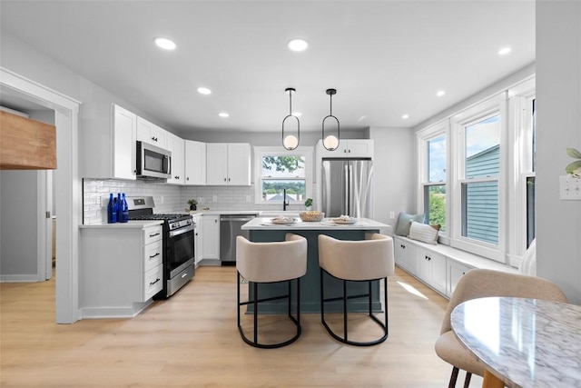 1610 Duffield St, Morningside, PA 15206 - kitchen featuring stainless steel appliances, healthy amount of natural light, light wood-style floors, backsplash, and recessed lighting