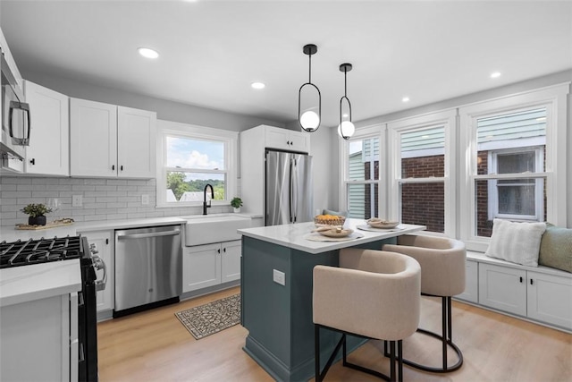 1610 Duffield St, Morningside, PA 15206 - kitchen with appliances with stainless steel finishes, light wood-style floors, light countertops, and recessed lighting