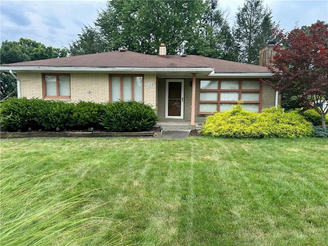 130 Overlook Dr, Brighton Twp, PA 15009 - ranch-style home with a chimney, brick siding, and a front lawn