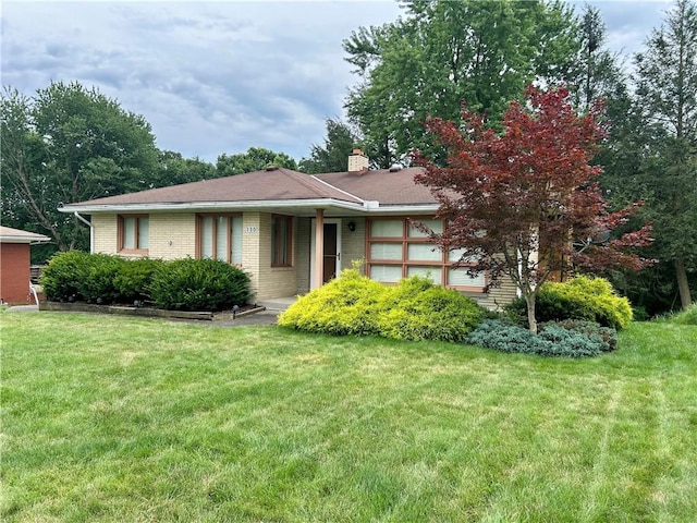 130 Overlook Dr, Brighton Twp, PA 15009 - single story home with a front lawn, brick siding, and a chimney