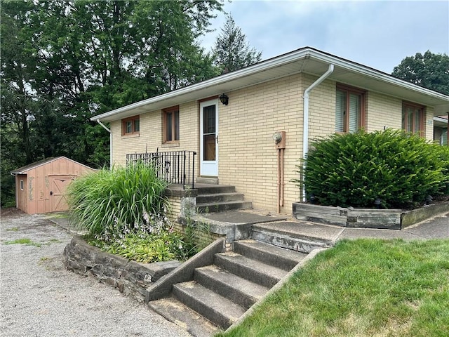 130 Overlook Dr, Brighton Twp, PA 15009 - ranch-style house featuring brick siding and a storage shed