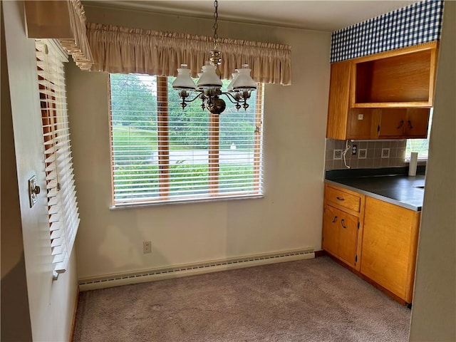 130 Overlook Dr, Brighton Twp, PA 15009 - unfurnished dining area featuring a chandelier, a baseboard radiator, and light carpet