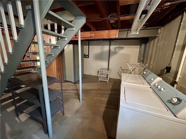 130 Overlook Dr, Brighton Twp, PA 15009 - unfinished basement featuring washing machine and dryer, stairs, and concrete block wall