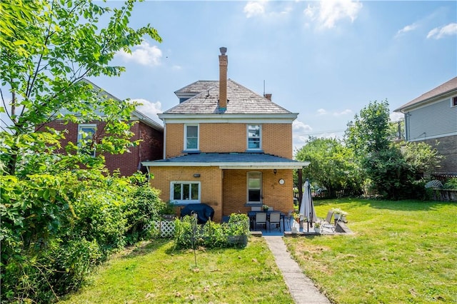 2102 Vodeli St, Beechview, PA 15216 - back of property featuring brick siding, a high end roof, and a patio