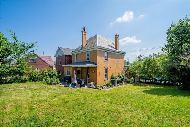 2102 Vodeli St, Beechview, PA 15216 - rear view of property featuring a chimney, a patio, and a high end roof