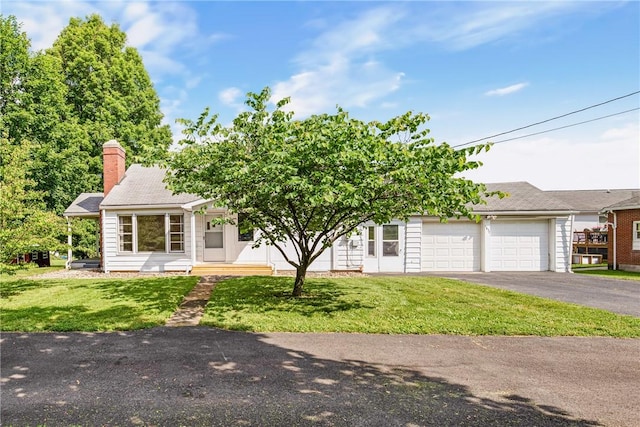 1837 Stoystown, Somerset Twp, PA 15541 - view of front of property featuring an attached garage, driveway, a front yard, and a chimney