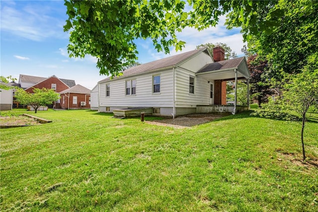 1837 Stoystown, Somerset Twp, PA 15541 - back of house with a chimney and a yard
