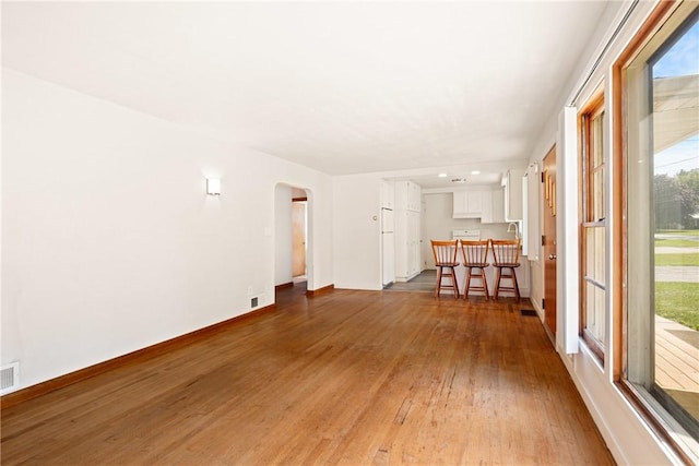 1837 Stoystown, Somerset Twp, PA 15541 - unfurnished living room featuring wood finished floors and arched walkways